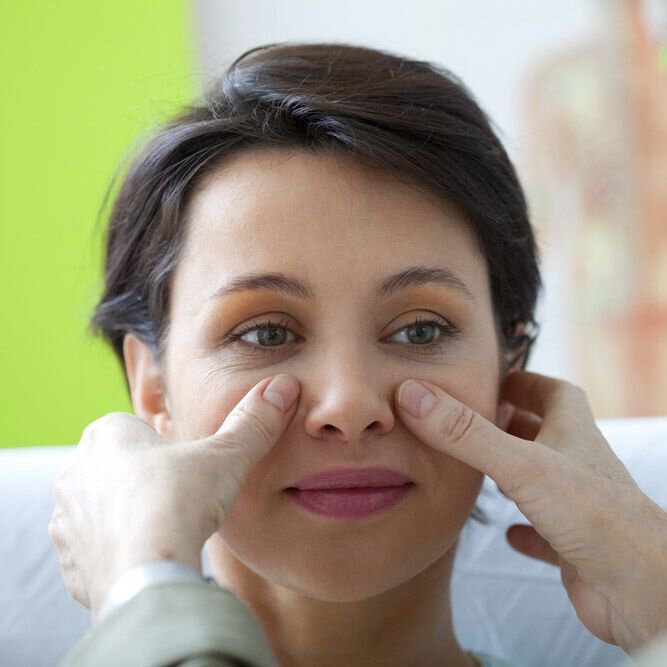 A woman being assessed for rhinoplasty
