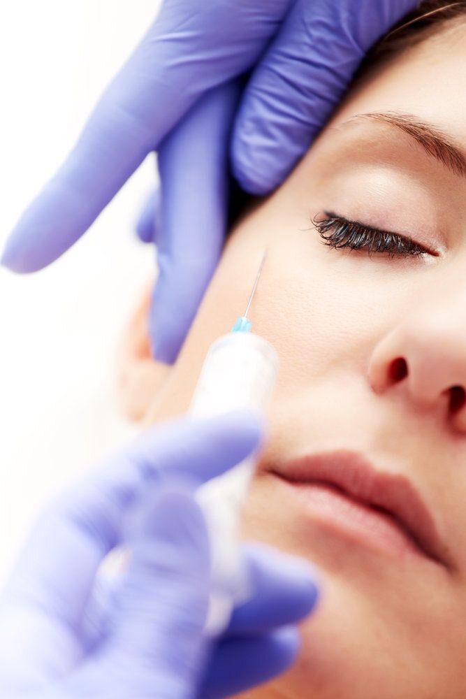 Woman receiving BOTOX® injections