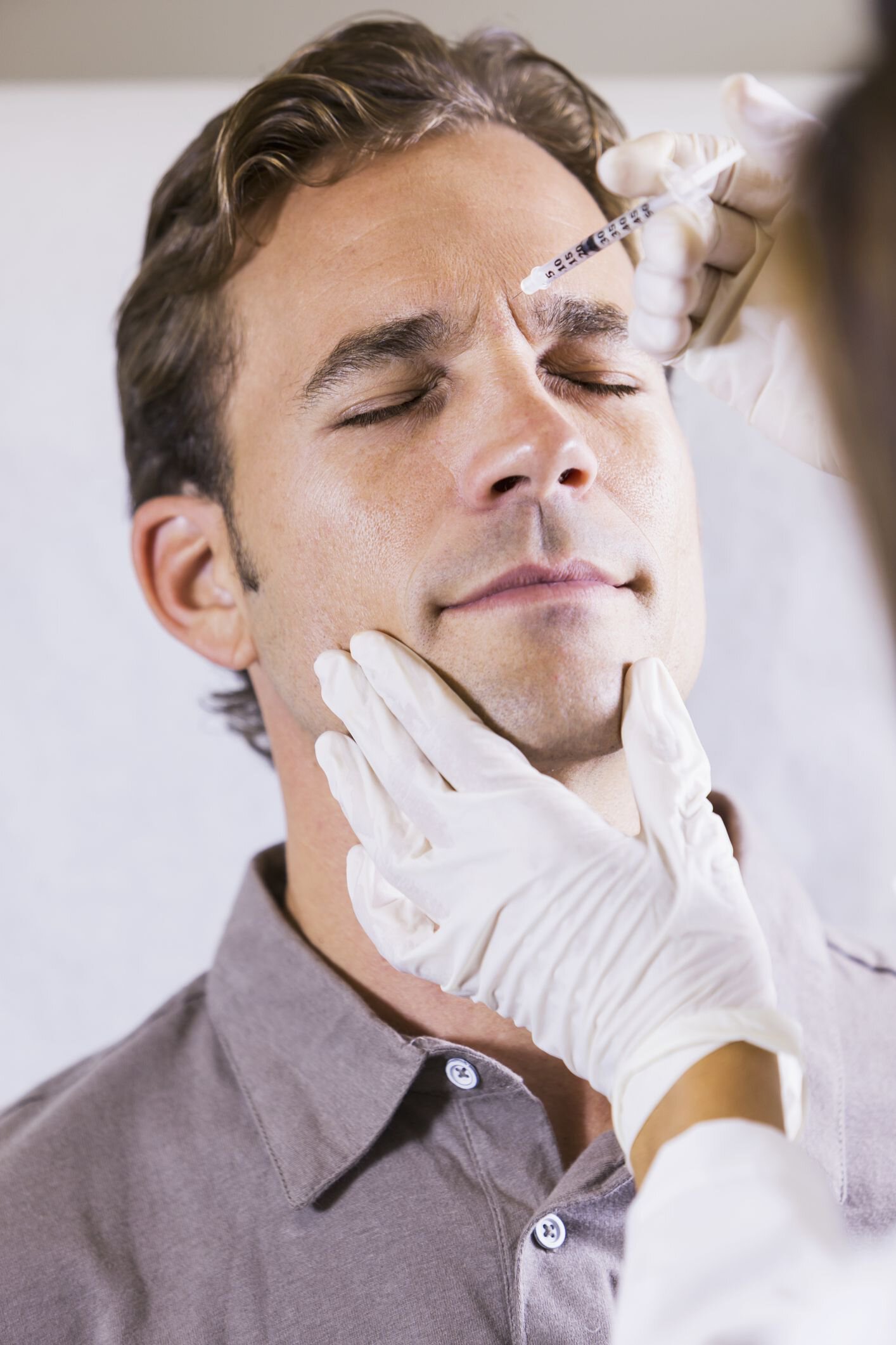 A man getting a cosmetic injection